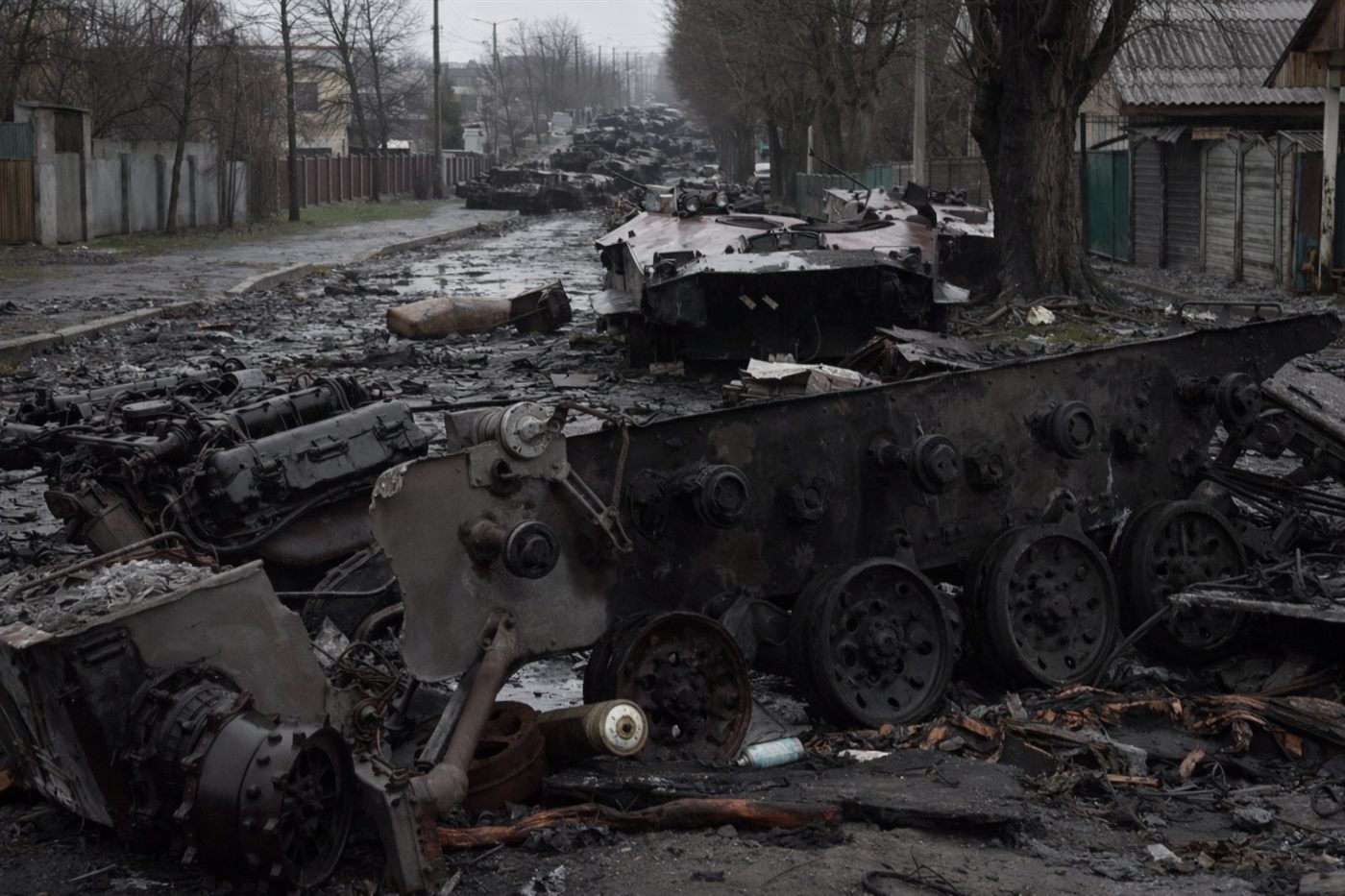 Destroyed and burned Russian military vehicles lining a residential street in Bucha, Ukraine, 2022